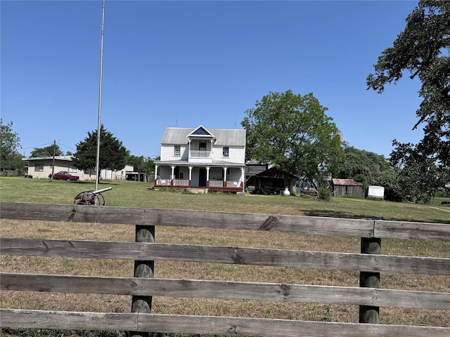 6346 Sand Rock Ln, Grange, TX 78945 - farmhouse-style home with a porch and metal roof