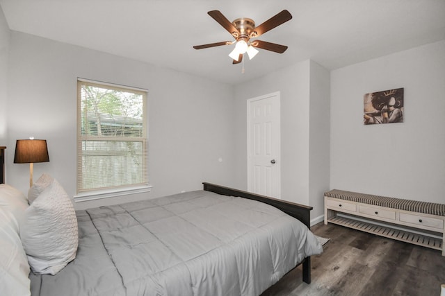 5410 Bataan Rd, Houston, TX 77033 - bedroom featuring wood finished floors, baseboards, and a ceiling fan