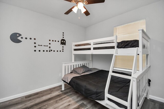 5410 Bataan Rd, Houston, TX 77033 - bedroom featuring baseboards, wood finished floors, and ceiling fan