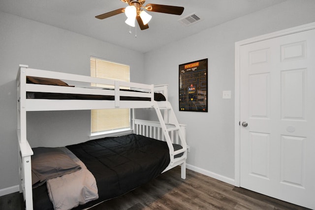 5410 Bataan Rd, Houston, TX 77033 - bedroom featuring baseboards, wood finished floors, and a ceiling fan