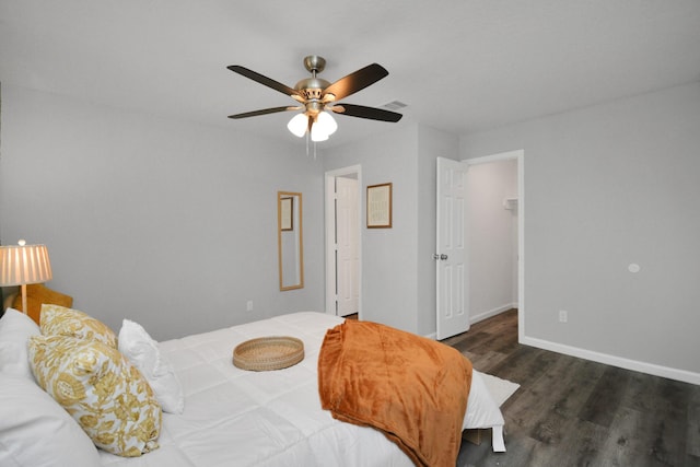 5410 Bataan Rd, Houston, TX 77033 - bedroom featuring wood finished floors, baseboards, ceiling fan, and a spacious closet