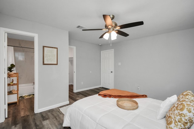 5410 Bataan Rd, Houston, TX 77033 - bedroom with wood finished floors, a spacious closet, baseboards, and ceiling fan