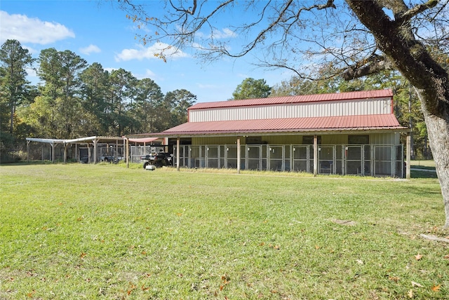 22981 Henson Rd, Montgomery, TX 77356 - rear view of house featuring metal roof and board and batten siding
