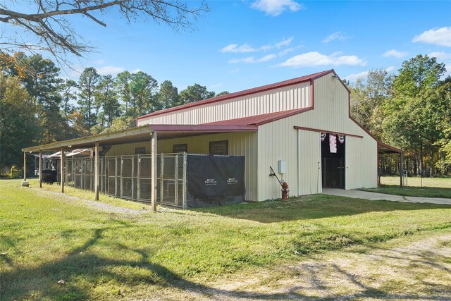 22981 Henson Rd, Montgomery, TX 77356 - view of pole building with a lawn