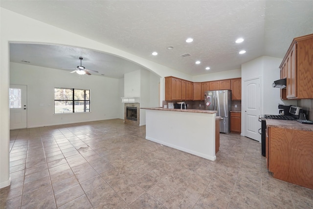 22981 Henson Rd, Montgomery, TX 77356 - kitchen with freestanding refrigerator, recessed lighting, ceiling fan, gas stove, and open floor plan