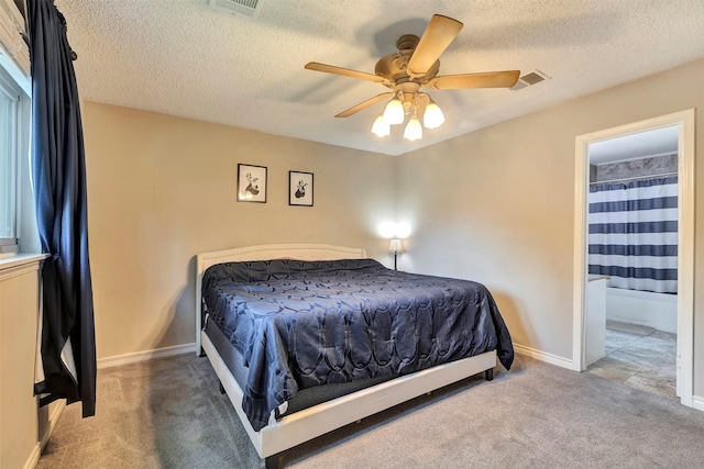 3202 Crossman St, Porter, TX 77365 - bedroom with light colored carpet, ensuite bath, a textured ceiling, baseboards, and ceiling fan