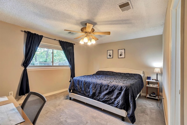 3202 Crossman St, Porter, TX 77365 - carpeted bedroom with a textured ceiling, baseboards, and ceiling fan