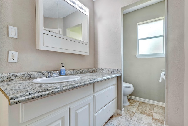 3202 Crossman St, Porter, TX 77365 - bathroom featuring vanity, toilet, and baseboards