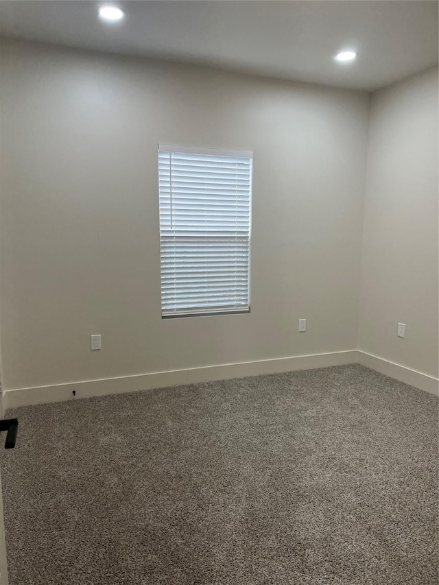 carpeted empty room with recessed lighting and baseboards
