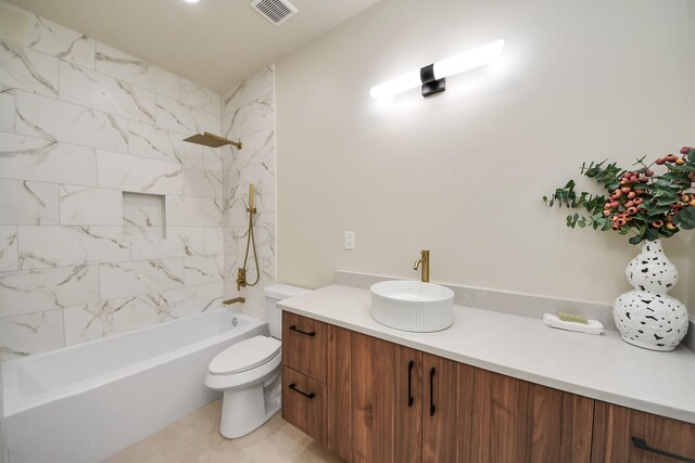 bathroom featuring vanity, shower / washtub combination, and toilet