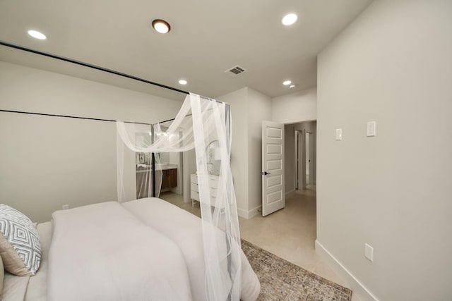 bedroom featuring recessed lighting and baseboards