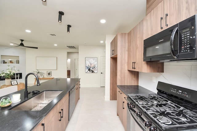 kitchen with range with gas cooktop, black microwave, a sink, a ceiling fan, and recessed lighting