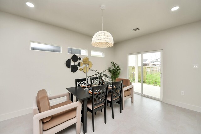 dining space featuring baseboards and recessed lighting