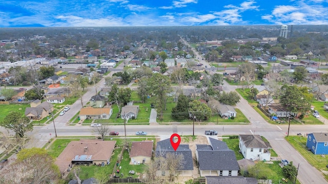 aerial view of property and surrounding area featuring nearby suburban area