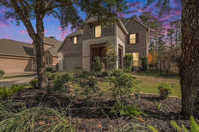 traditional home with fence and brick siding
