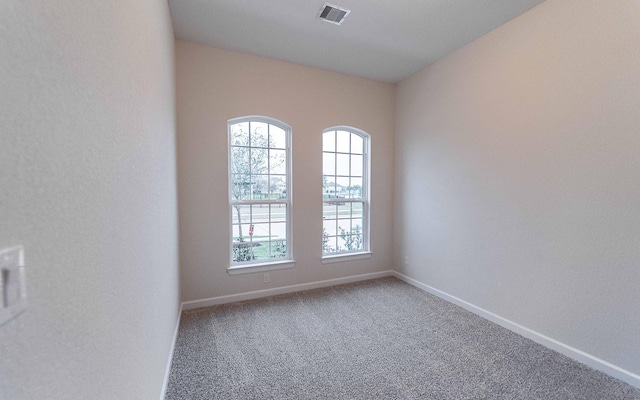 21215 Brook Tide Ln, Cypress, TX 77433 - spare room with baseboards, a healthy amount of sunlight, visible vents, and carpet floors