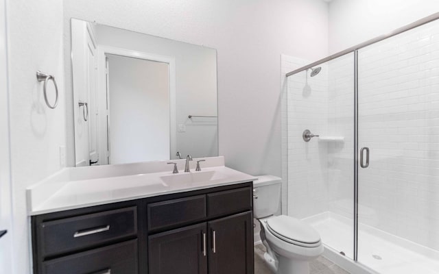 21215 Brook Tide Ln, Cypress, TX 77433 - full bathroom featuring vanity, toilet, and a shower stall