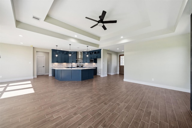 237 Crestview Dr, West Columbia, TX 77486 - kitchen featuring open floor plan, a tray ceiling, and visible vents