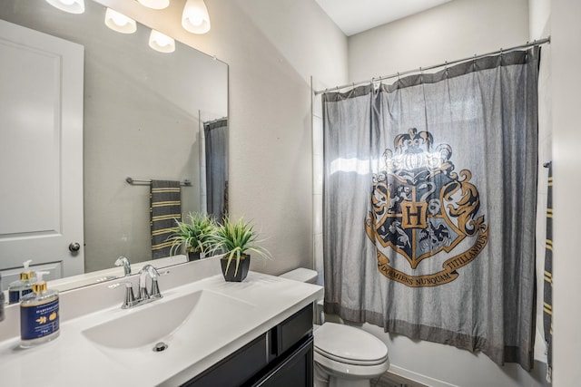 bathroom featuring shower / tub combo with curtain, vanity, and toilet