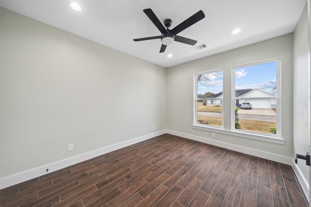 443 Wellshire Dr, West Columbia, TX 77486 - unfurnished room featuring visible vents, baseboards, ceiling fan, dark wood-style floors, and recessed lighting