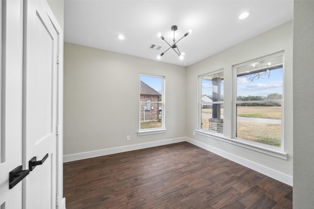 443 Wellshire Dr, West Columbia, TX 77486 - unfurnished room with visible vents, recessed lighting, an inviting chandelier, dark wood-style flooring, and baseboards