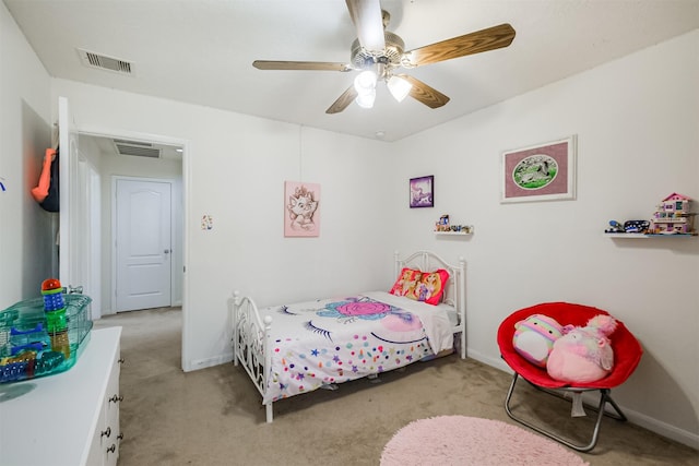 bedroom with visible vents, baseboards, and light carpet