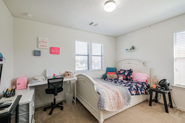 bedroom with carpet flooring and visible vents