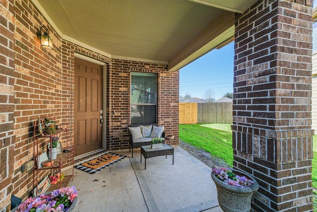 view of patio / terrace featuring fence and an outdoor living space