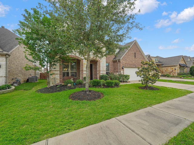 view of front of home with central air condition unit, brick siding, driveway, and a front yard