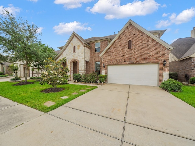 traditional-style house featuring a garage, a front yard, brick siding, and driveway