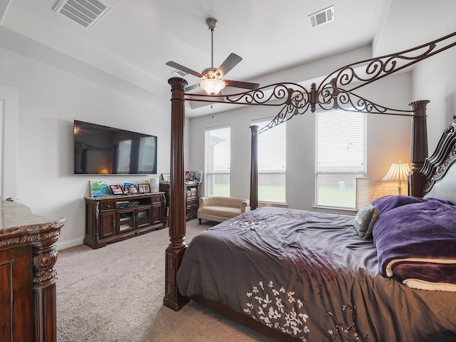 bedroom featuring carpet, baseboards, a ceiling fan, and visible vents