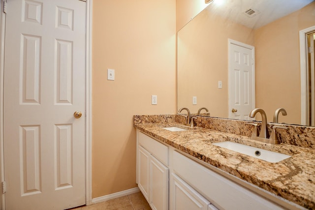 full bathroom featuring a sink, tile patterned flooring, baseboards, and visible vents