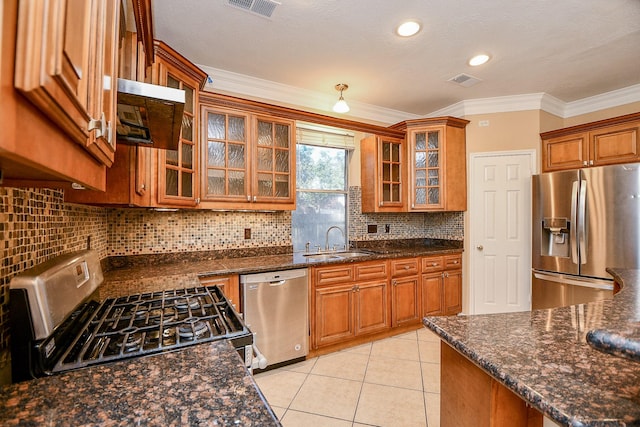 kitchen with a sink, brown cabinetry, stainless steel appliances, ventilation hood, and crown molding