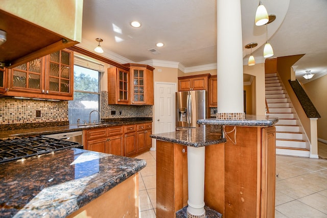 kitchen with a sink, brown cabinets, stainless steel refrigerator with ice dispenser, decorative backsplash, and light tile patterned floors