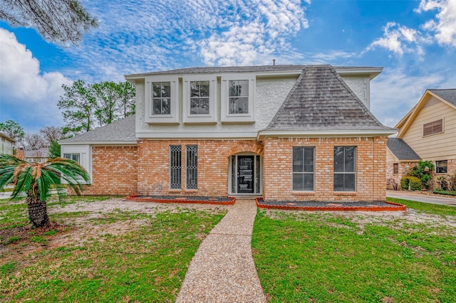 4218 Bayglen Ct, Houston, TX 77068 - view of front facade featuring roof with shingles, a front lawn, and brick siding