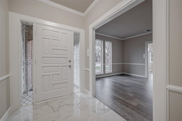4218 Bayglen Ct, Houston, TX 77068 - foyer entrance with crown molding, marble finish floor, visible vents, and baseboards