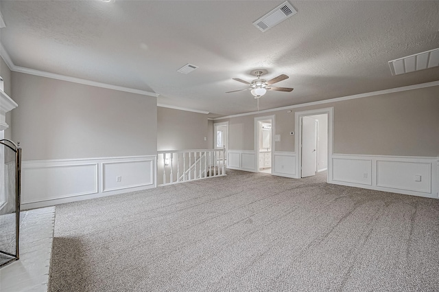 4218 Bayglen Ct, Houston, TX 77068 - carpeted empty room with ornamental molding, a decorative wall, a ceiling fan, and visible vents