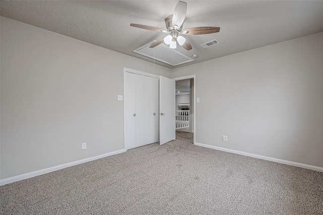 4218 Bayglen Ct, Houston, TX 77068 - unfurnished bedroom featuring attic access, a closet, visible vents, baseboards, and light colored carpet