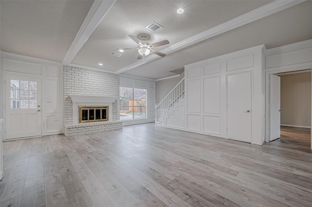4218 Bayglen Ct, Houston, TX 77068 - unfurnished living room featuring light wood finished floors, a decorative wall, a ceiling fan, and visible vents