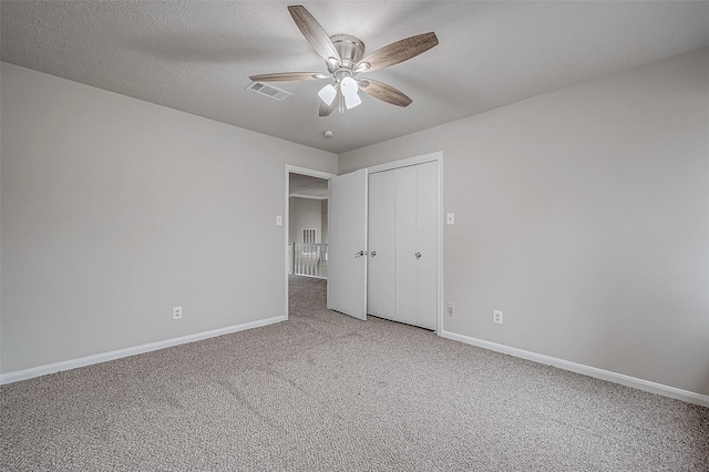 4218 Bayglen Ct, Houston, TX 77068 - unfurnished bedroom featuring a closet, visible vents, light carpet, a ceiling fan, and baseboards