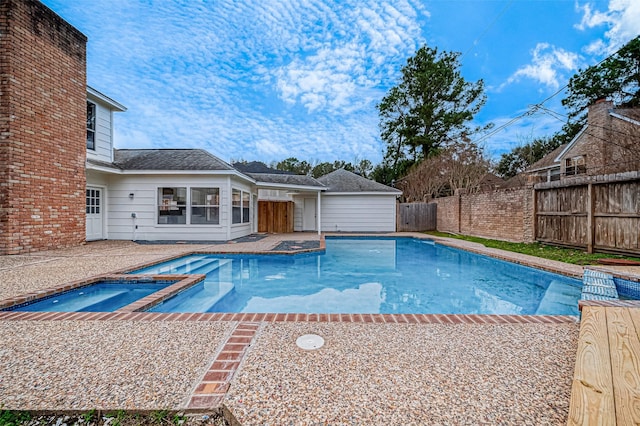 4218 Bayglen Ct, Houston, TX 77068 - view of swimming pool featuring a patio area, a pool with connected hot tub, and a fenced backyard