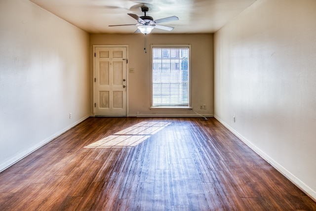 401 E Main St, Brenham, TX 77833 - empty room featuring ceiling fan, wood finished floors, and baseboards