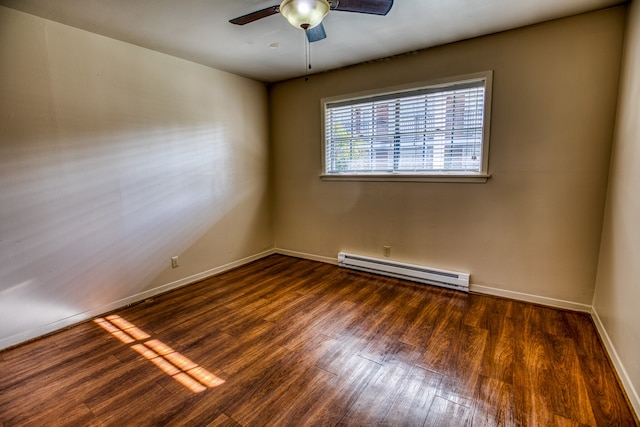401 E Main St, Brenham, TX 77833 - spare room with a baseboard radiator, wood finished floors, ceiling fan, and baseboards