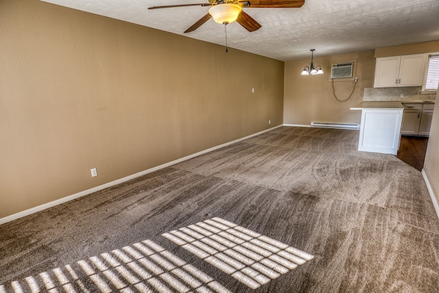 401 E Main St, Brenham, TX 77833 - unfurnished living room with carpet flooring, ceiling fan, a baseboard radiator, baseboards, and a textured ceiling