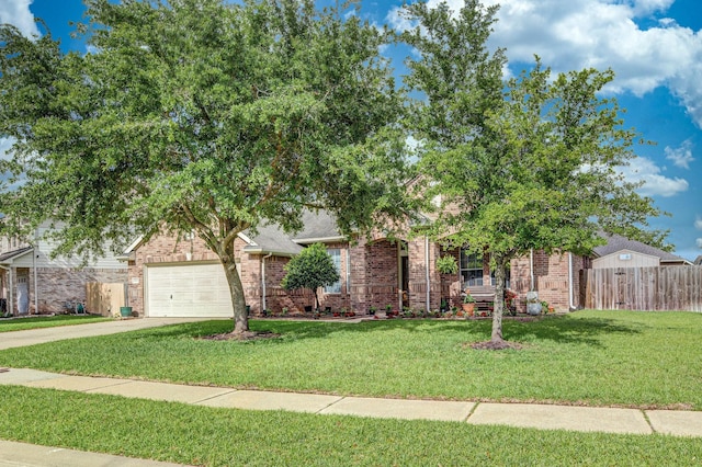 obstructed view of property featuring driveway, brick siding, a front yard, and fence