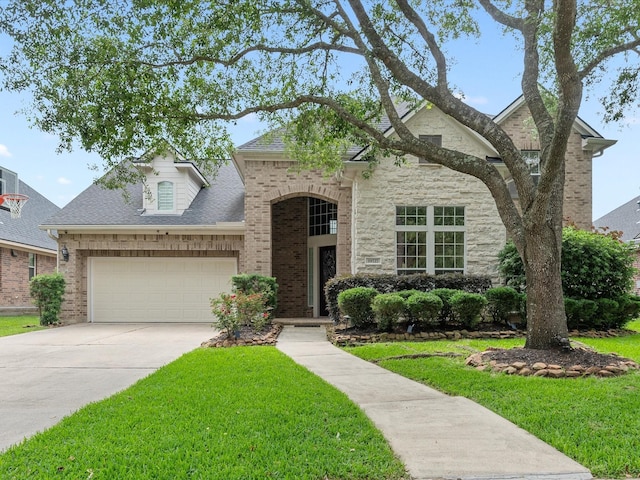 traditional-style house featuring a front lawn, brick siding, an attached garage, and concrete driveway