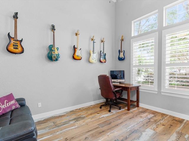 office space featuring baseboards and hardwood / wood-style floors