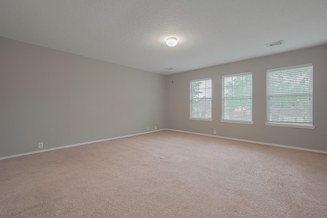 14910 Sugar Crystal Ct, Sugar Land, TX 77498 - unfurnished room featuring light colored carpet, baseboards, and visible vents