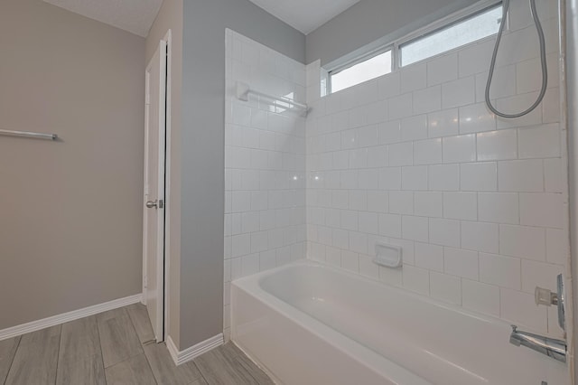 14910 Sugar Crystal Ct, Sugar Land, TX 77498 - full bathroom featuring wood finished floors, baseboards, and shower / tub combination