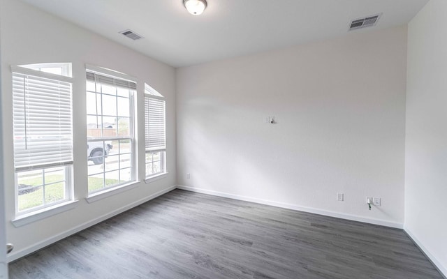 8406 Crab Blossom Dr, Cypress, TX 77433 - unfurnished room featuring dark wood-style flooring, baseboards, and visible vents